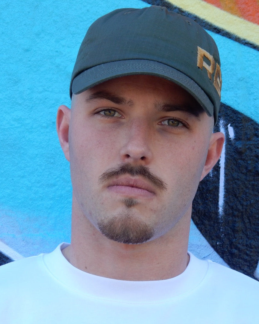 OLIVE GREEN “REFUSE” HAT